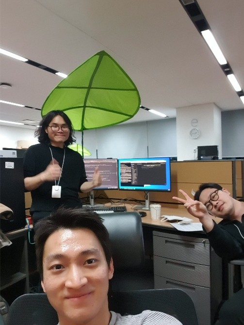 Jun Hyuk Lee with teammates at the NCSOFT office
